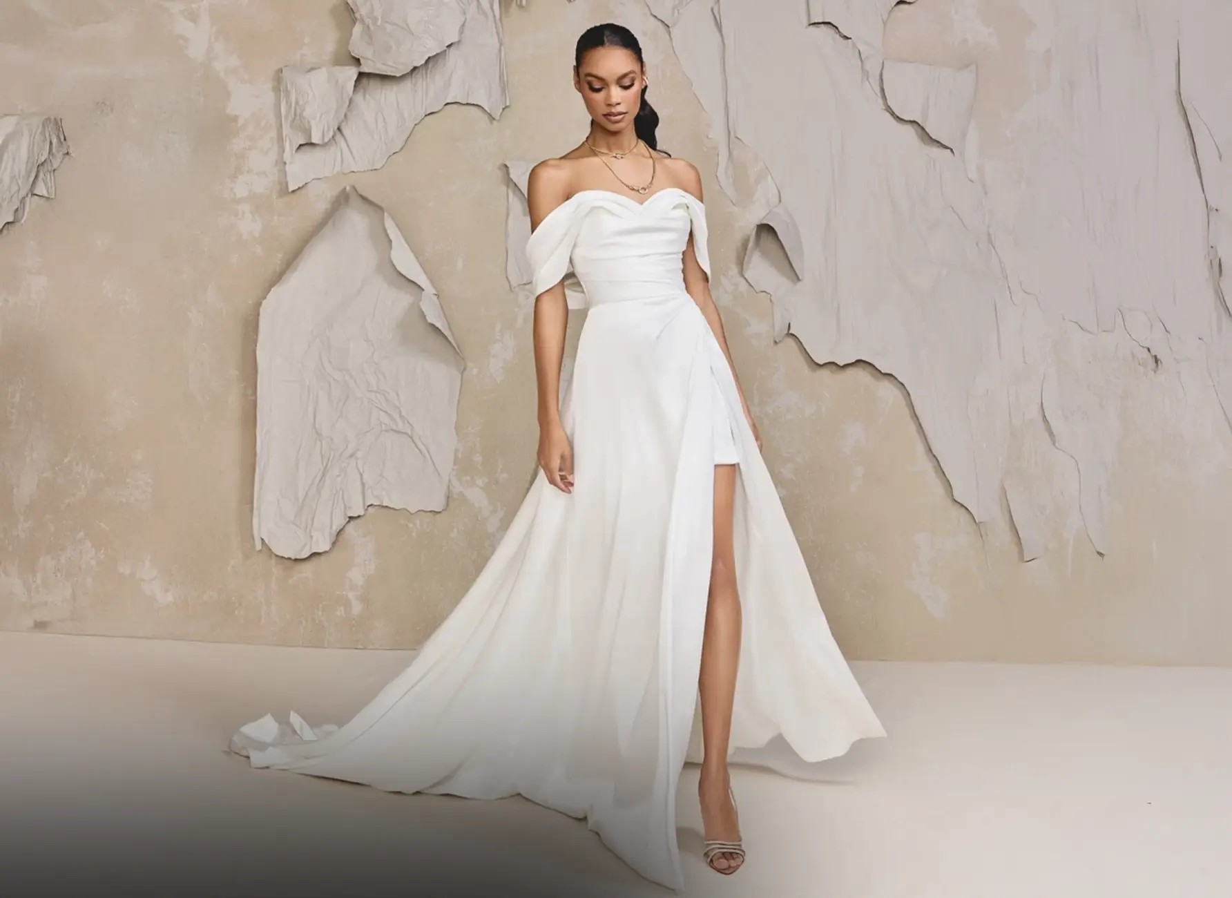 Model wearing a white gown by Justin Alexander Signature